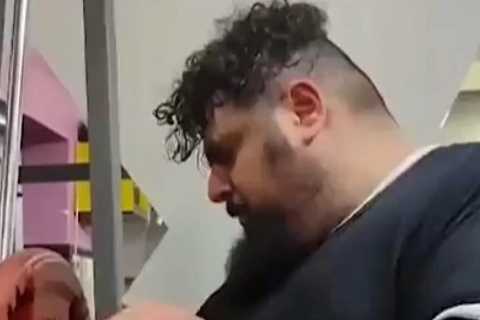 Watch Iranian Hulk in bizarre training routine for Kazakh Titan fight that includes punching a metal weight