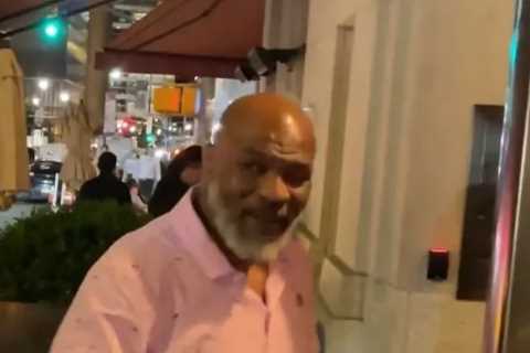 Fearsome Mike Tyson, 56, pictured using walking stick as former heavyweight champion arrives at New York hotel