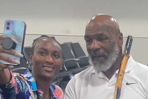 Mike Tyson, 56, pictured in wheelchair holding walking stick as fearsome boxing legend is pushed through Miami airport