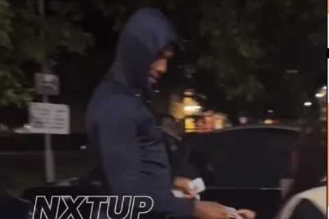 Anthony Joshua hands £20 notes from wad of cash to stunned kids in Watford on estate where he grew up