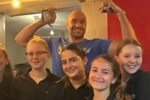 Tyson Fury and Molly Mae Hague pose for pictures with fans after visiting local cafe for fry-up