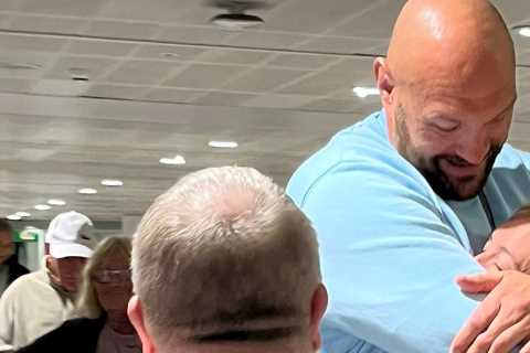 Tyson Fury hugs wife Paris at airport as he returns from family holiday in Tenerife to prepare for Oleksandr Usyk fight