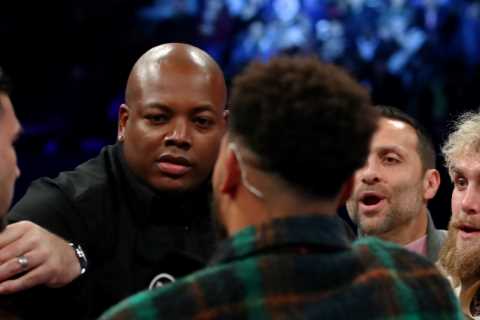 Jake Paul and topless Tommy Fury pulled apart in fiery exchange as bitter boxing rivals come face to face for first time