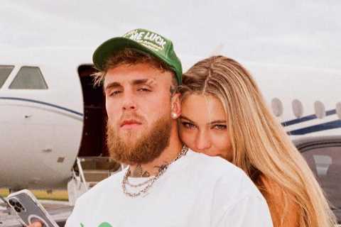 Jake Paul looks loved-up as he poses outside private jet with world’s hottest speed skater girlfriend and pet dog