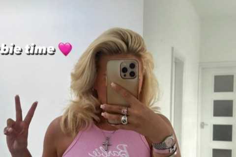 Busty ring girl Apollonia Llewellyn suffers wardrobe malfunction in revealing pink crop top as she watches Barbie movie