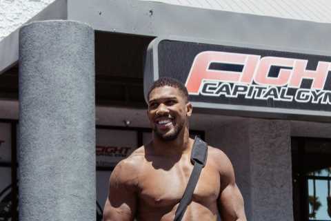 Topless Anthony Joshua leaves Playboy bunny and ring girl in awe as boxer shows off bulging muscles